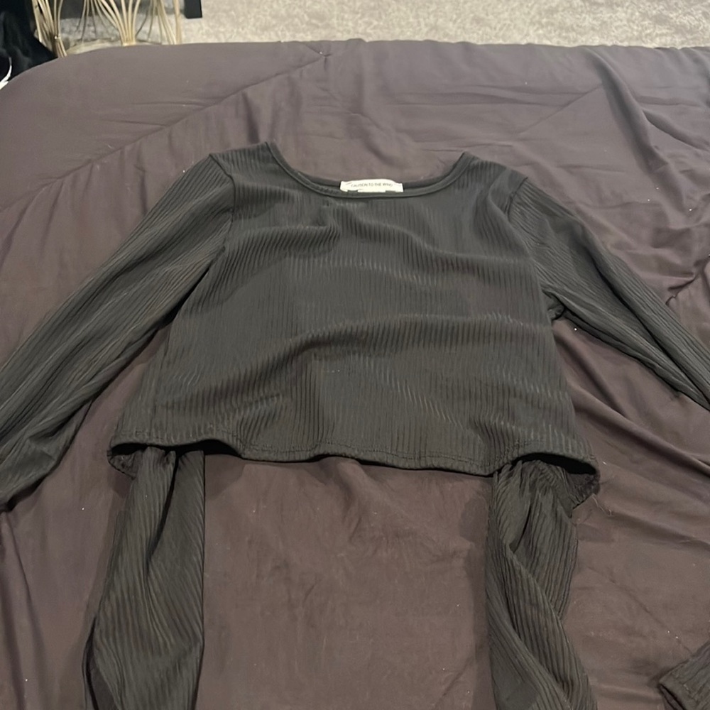 black long sleeve, ties in the back, hole in the back